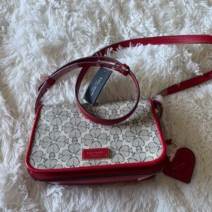 The Kate Spade New York Liv Spade Flower Coated Canvas Small Flap Crossbody bag